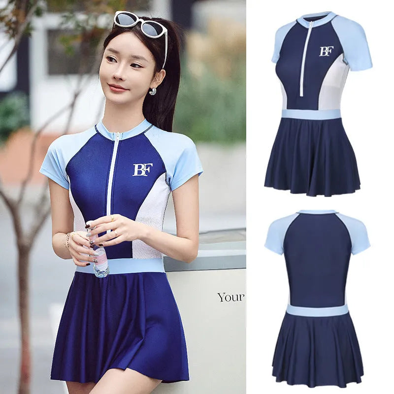 Ladies conservative sports one-piece swimsuit in a colour-matching pattern, shown on a model.