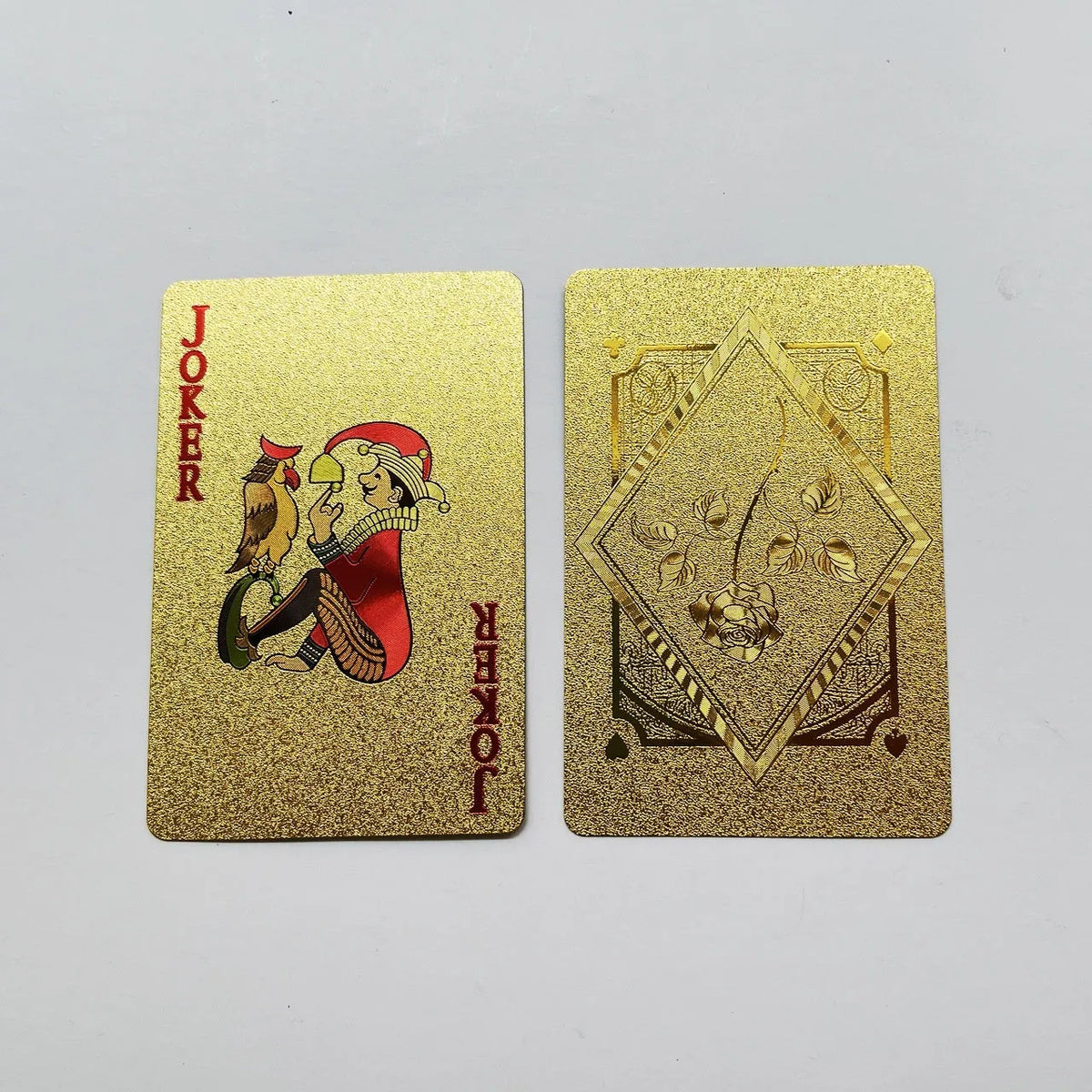 Gold foil playing cards with black rose design, 57x87mm size, metallic finish