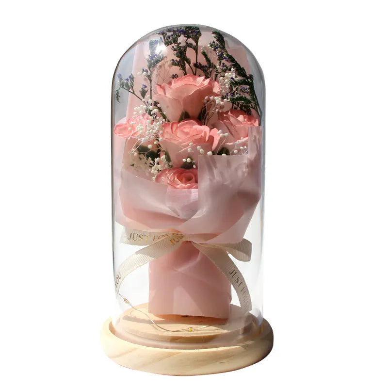 Dried flower and soap flower bouquet under glass dome on wooden LED base, available in multiple colours including Aisha Pink and Light Purple