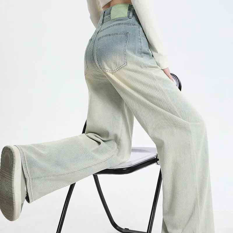 Women's gradient blue straight-leg denim trousers with wide leg style on hanger