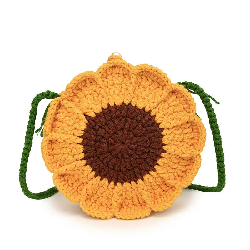 Hand-woven bag with crocheted wool flowers and mobile phone compartment in round suitcase shape