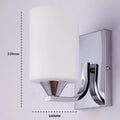 Chrome-finished modern wall lamp with glass shade, shown in single head configuration.