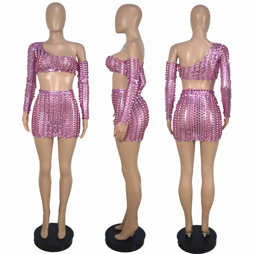 Women's black hollow-out net sleeveless top and short skirt two-piece dress set on a hanger.