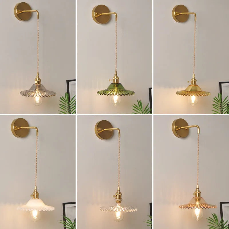 Retro copper Lotus wall lamp with a glass shade in a choice of six colours on a wall.