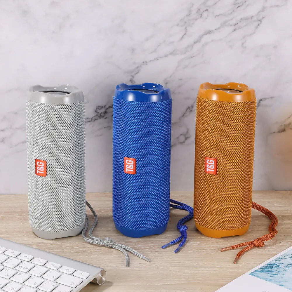 Fabric portable Bluetooth speaker with integrated card holder in multiple colour options.