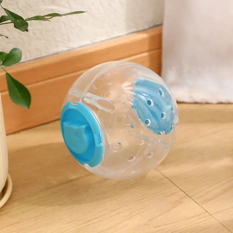 Clear blue ABS plastic slow feeder ball for cats, 11.5cm in diameter, on a wooden floor.