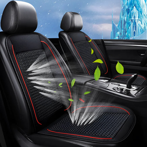 Black car ventilation seat cushion with power cord, shown on a car seat