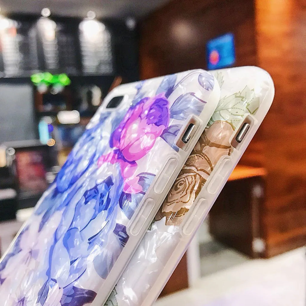 Dream Shell soft TPU iPhone case with rose flower pattern on back, shown in brown colour.