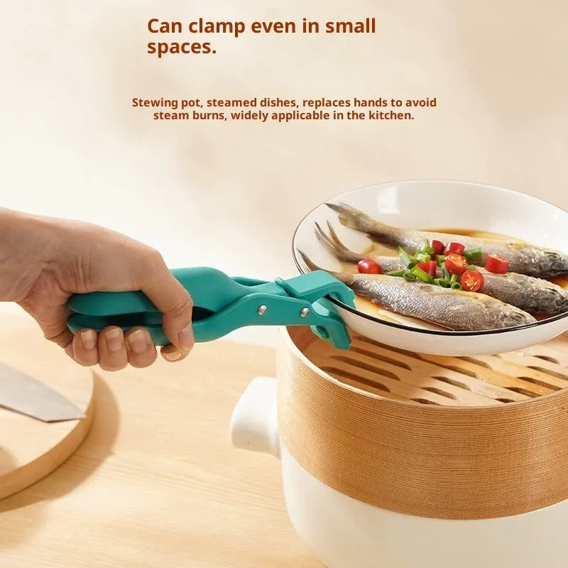 Carmine coloured anti-scalding clip with PP handle and silicone grip on kitchen counter