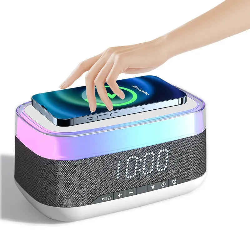 White multifunctional alarm clock with Bluetooth speaker and wireless charging pad display