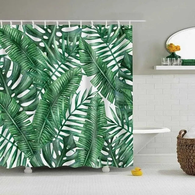 Tropical shower curtain with green foliage and white digital print on polyester, shown in a bathroom setting.