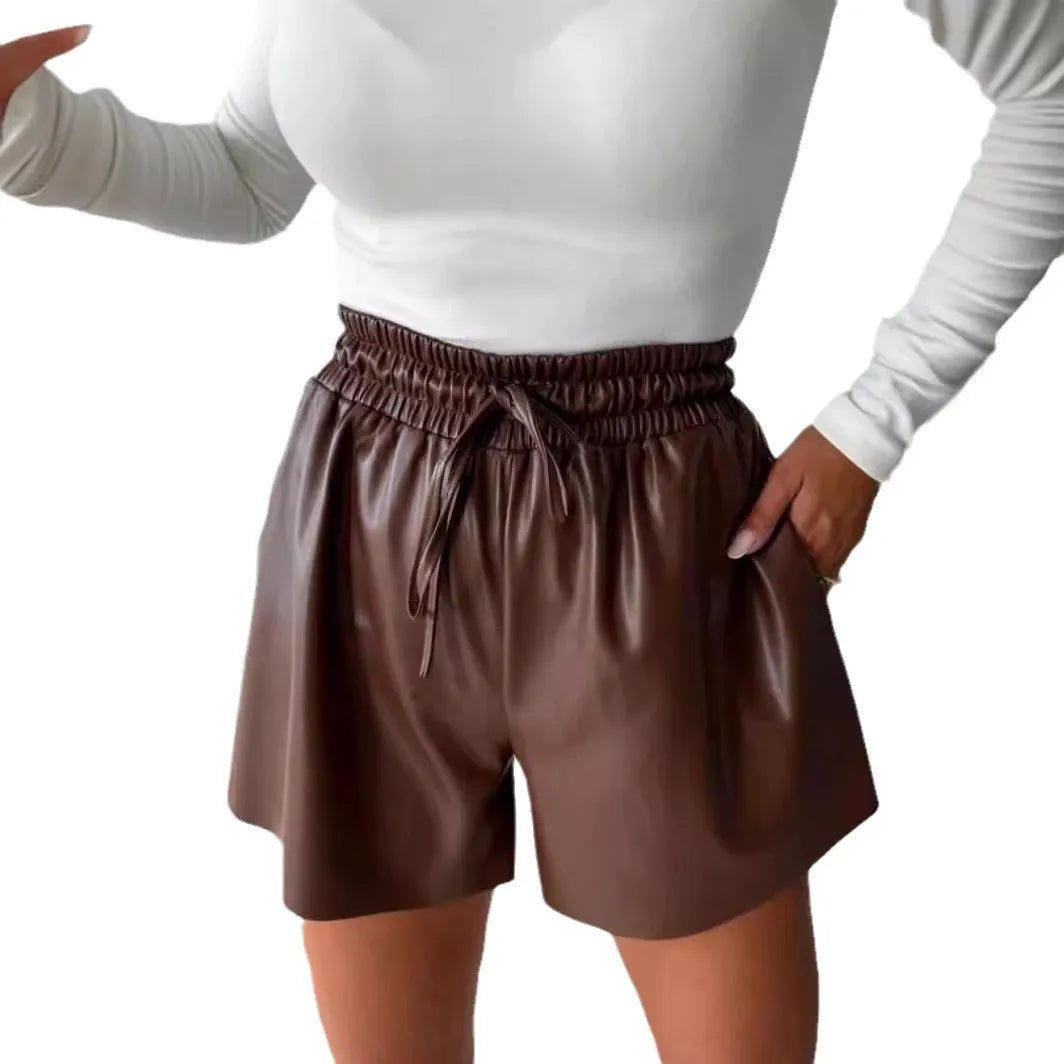 Black wide-leg women's shorts with a front drawstring lace-up waist detail on a mid-waist.