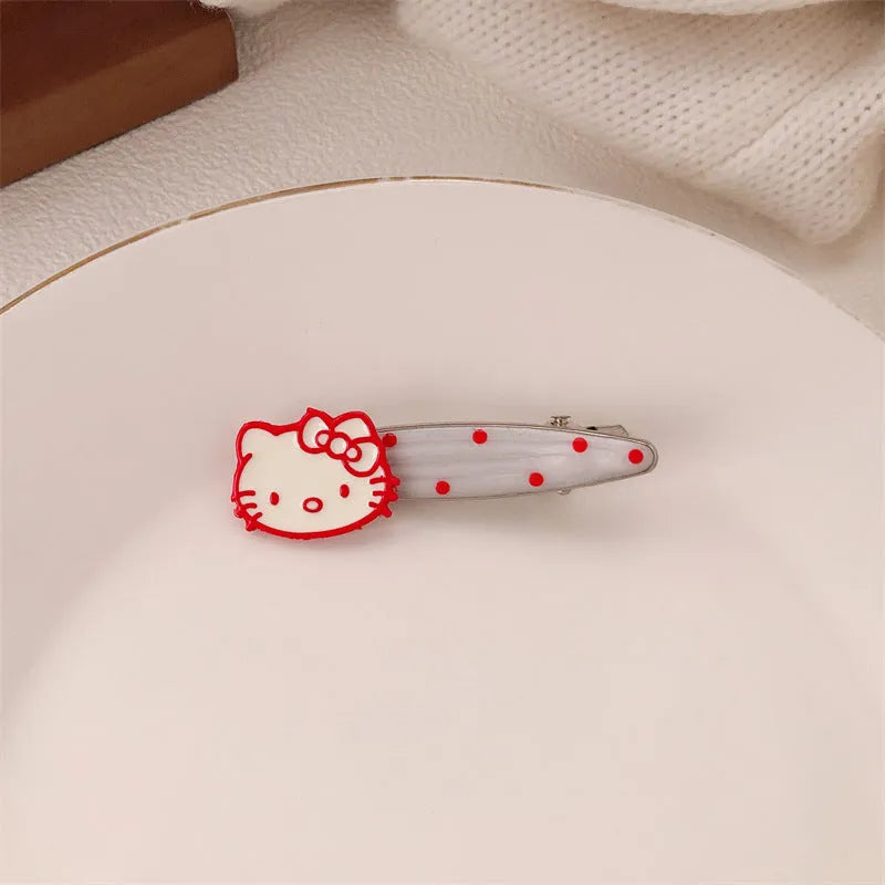 Red love heart-shaped plastic hair clip with retro dots and a willow leaf silhouette on a white background.