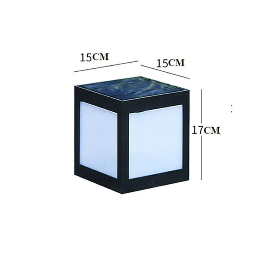 A set of waterproof solar-powered garden lights installed along a lawn edge and wall.