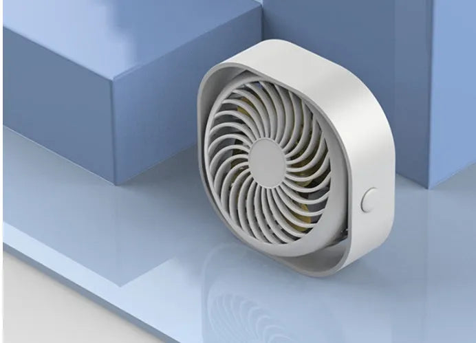 Compact USB desk fan in blue with 360-degree rotation head and rotary switch.