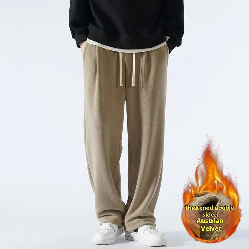 Man wearing apricot coloured loose-fit fleece-lined casual trousers with an elasticated waist.