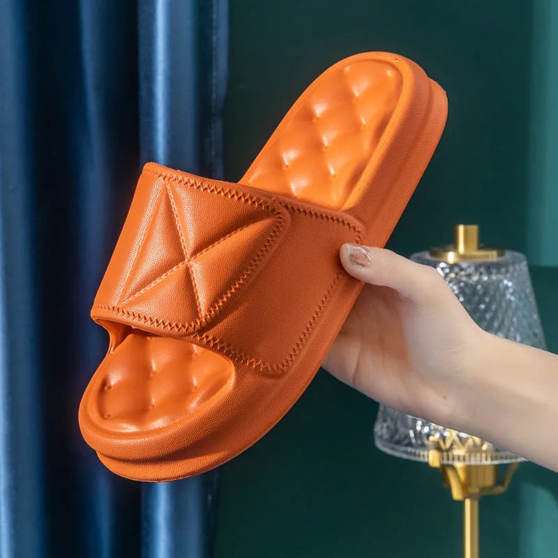 Pair of soft EVA non-slip bathroom slippers with a thick sole, shown in a choice of colours.