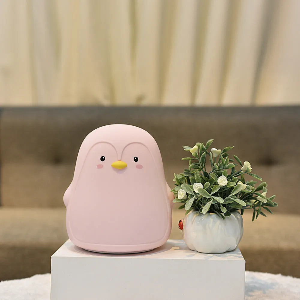 White penguin-shaped night light with USB rechargeable battery and soft LED illumination