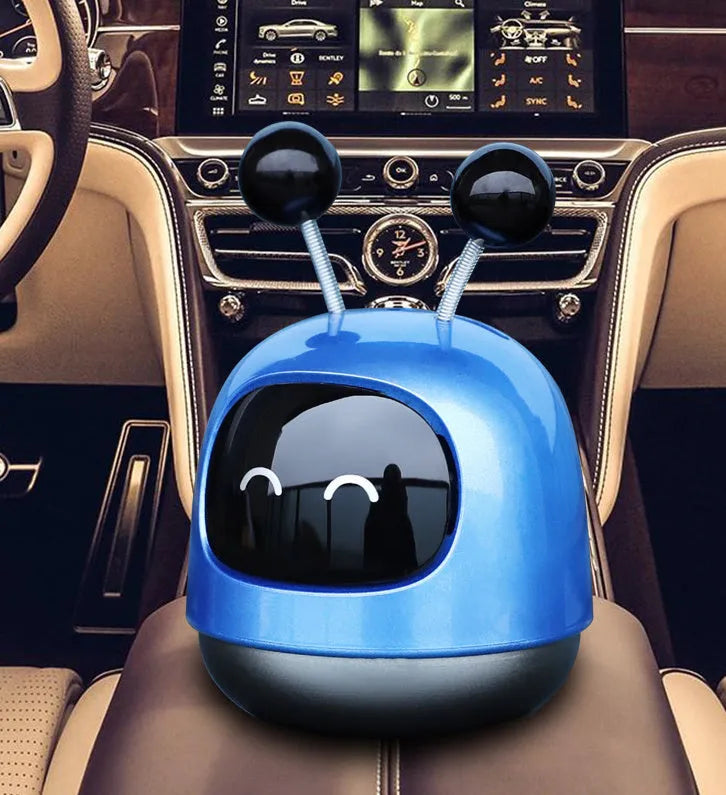 Robot-shaped car vent aromatherapy air freshener diffuser in blue, grey, or red.