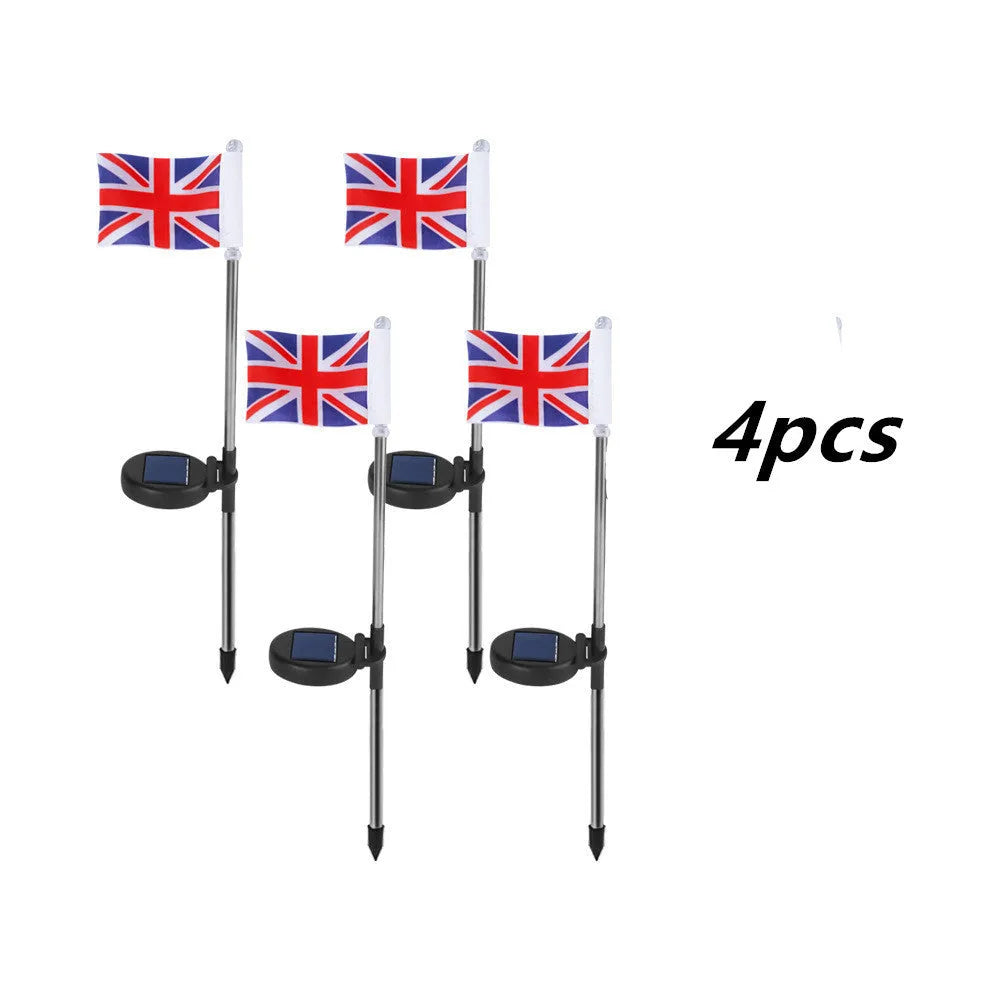 Solar-powered stainless steel garden flag light showing American flag design with white LEDs illuminated.