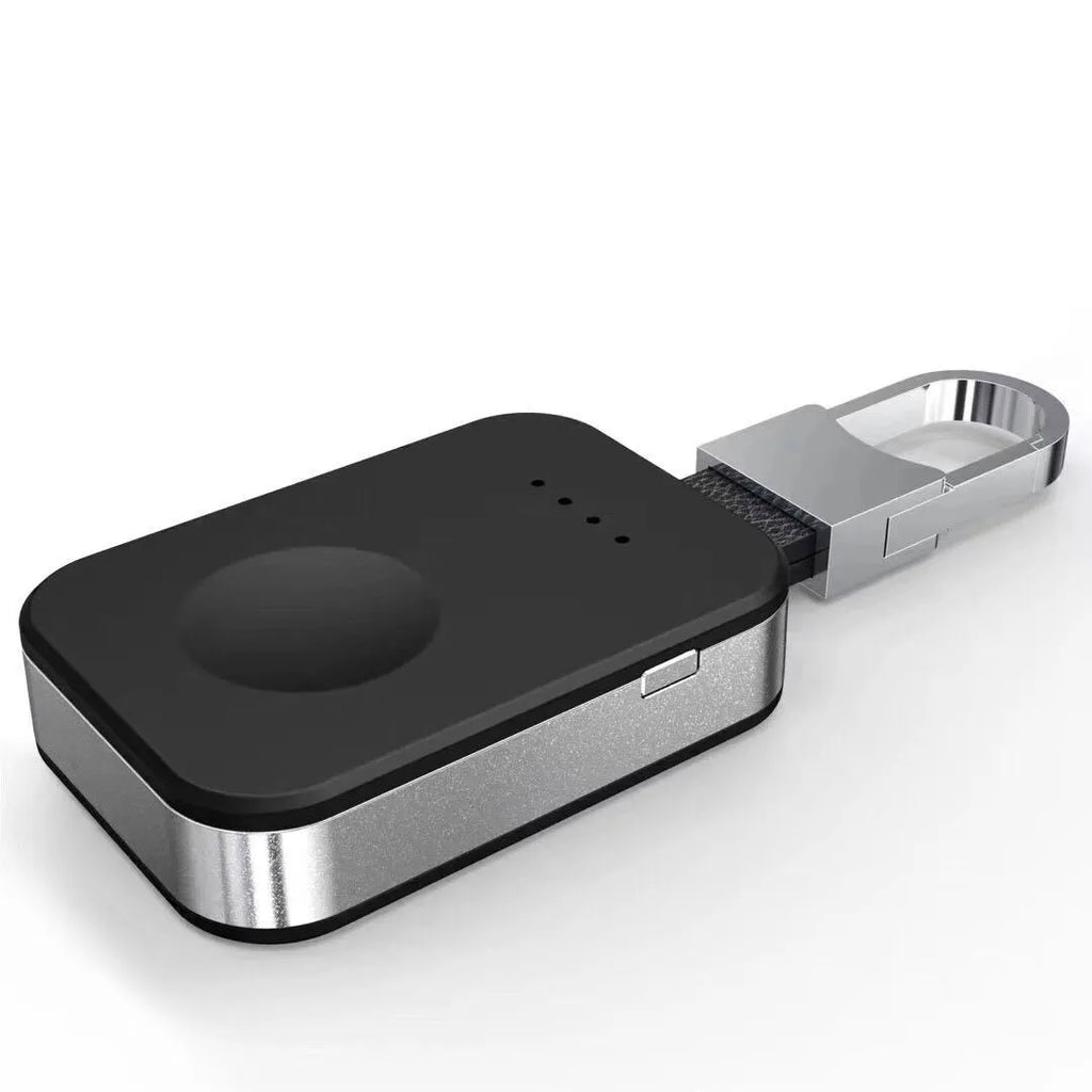 Black Apple Watch wireless keychain power bank on a keyring showing its compact size.