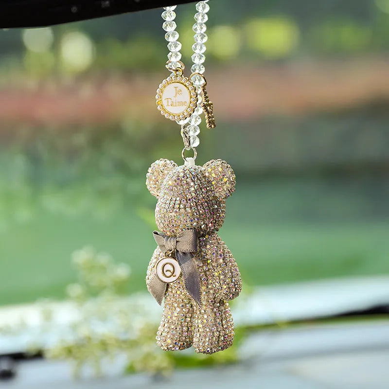 Crystal rhinestone Violent Bear car rearview mirror pendant in black, white, and mixed pastel colours.