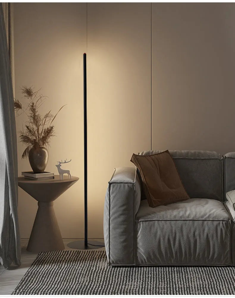 Vertical aluminium alloy floor lamp in modern simple style beside sofa