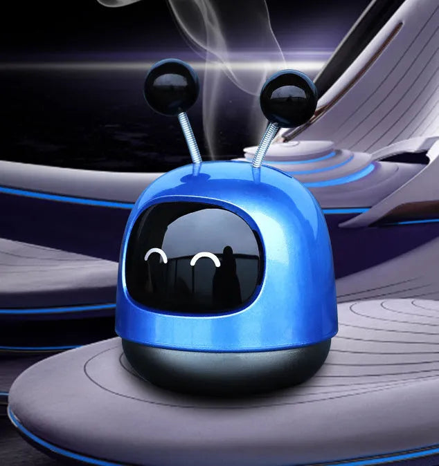 Robot-shaped car vent aromatherapy air freshener diffuser in blue, grey, or red.