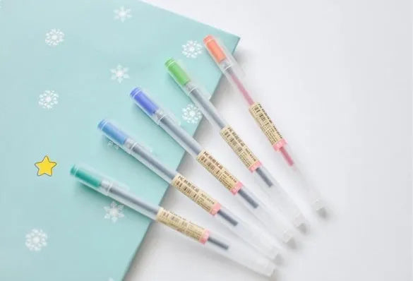 Muji 12-piece gel pen set showing fine 0.5mm tips and ink prevention mechanism