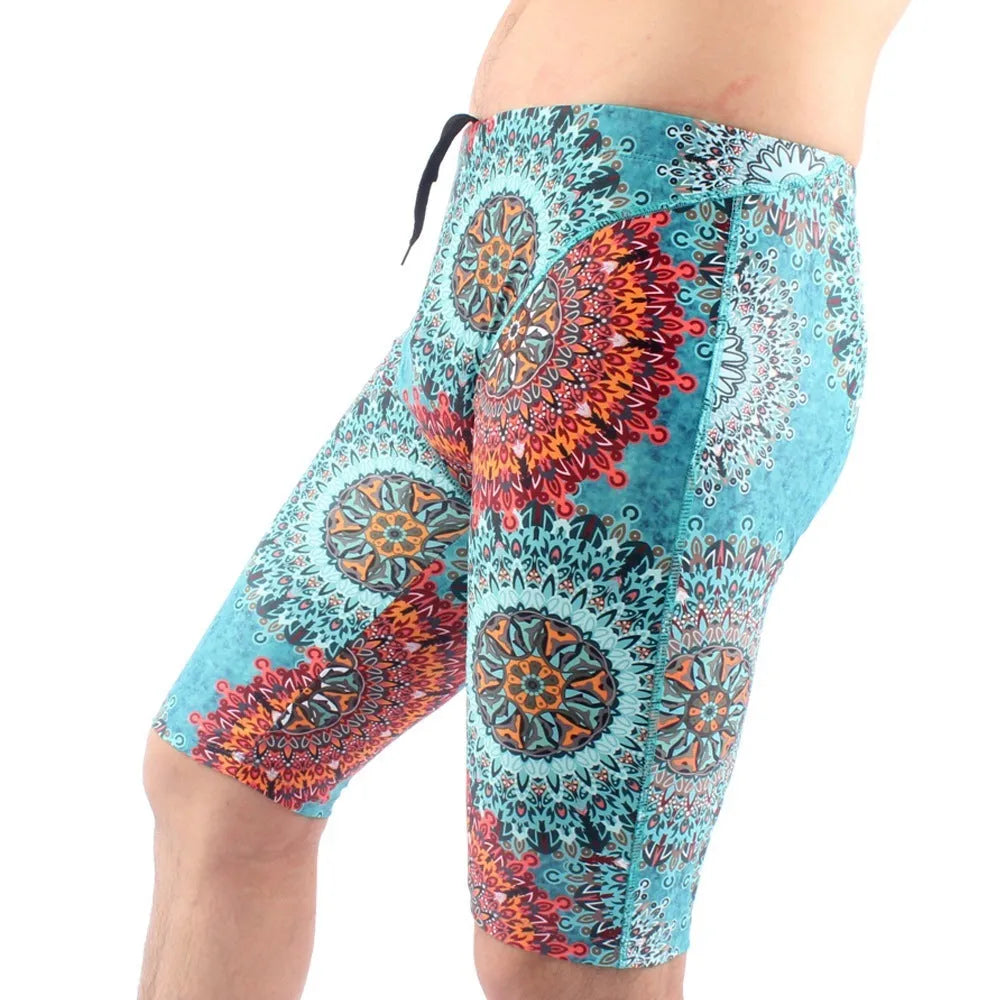 Green and navy blue men's loose-fit swimming trunks with a five-point design and polyester lining.