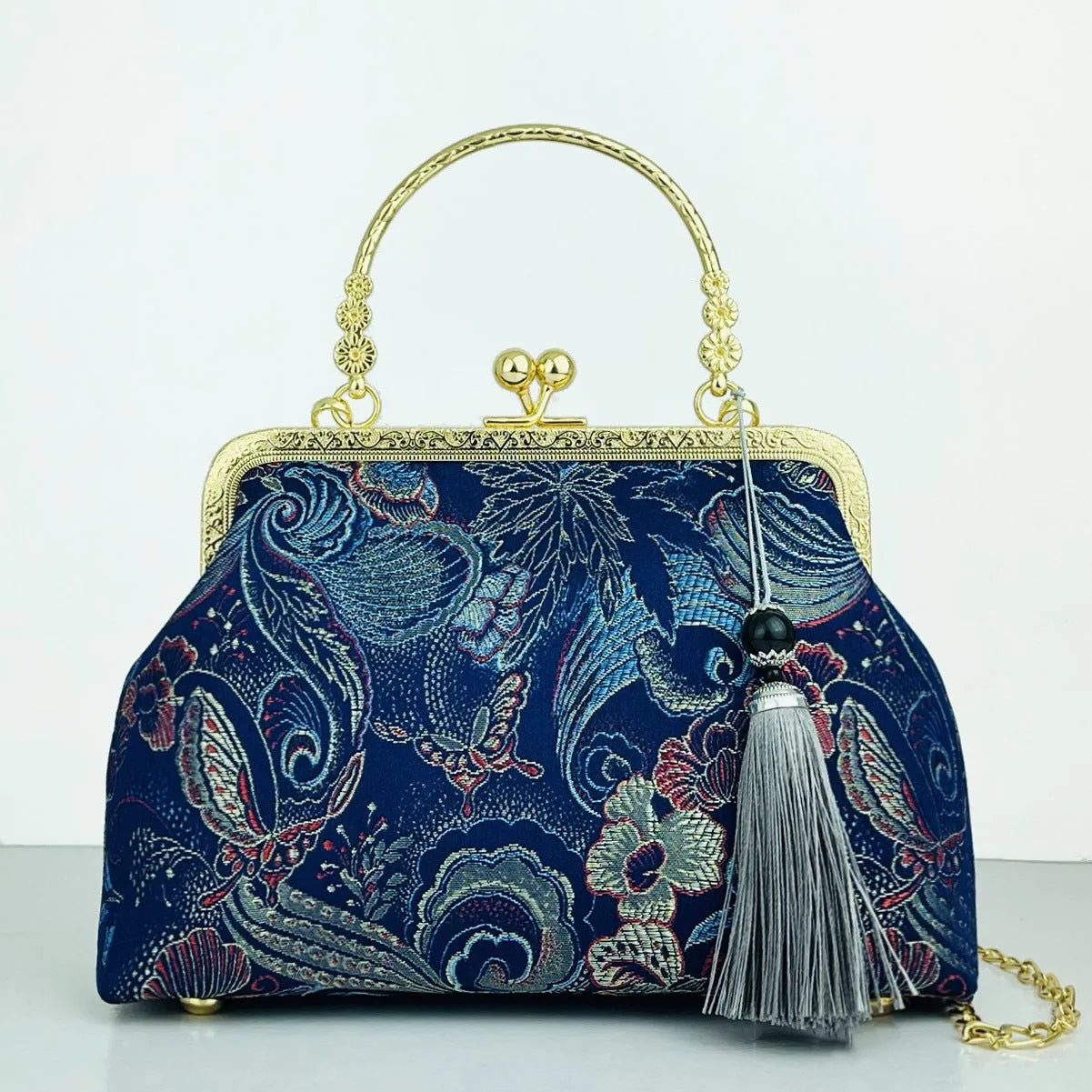 Chinese embroidery cheongsam handbag in polyester with shell shape and internal zipper compartment
