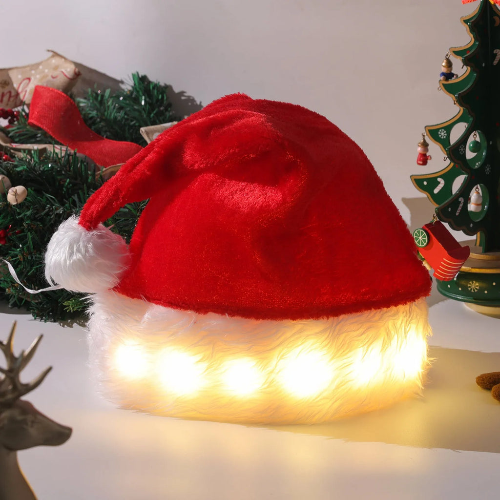 Red and white LED light up Santa hat with pom-pom, showing multicoloured twinkling lights on soft spandex material.