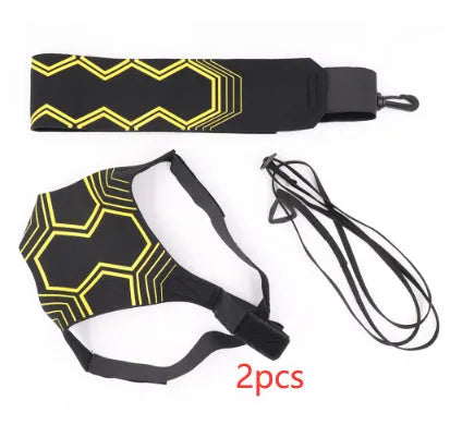 Black soccer training tether with adjustable waist belt and elastic Velcro strap on a green grass field