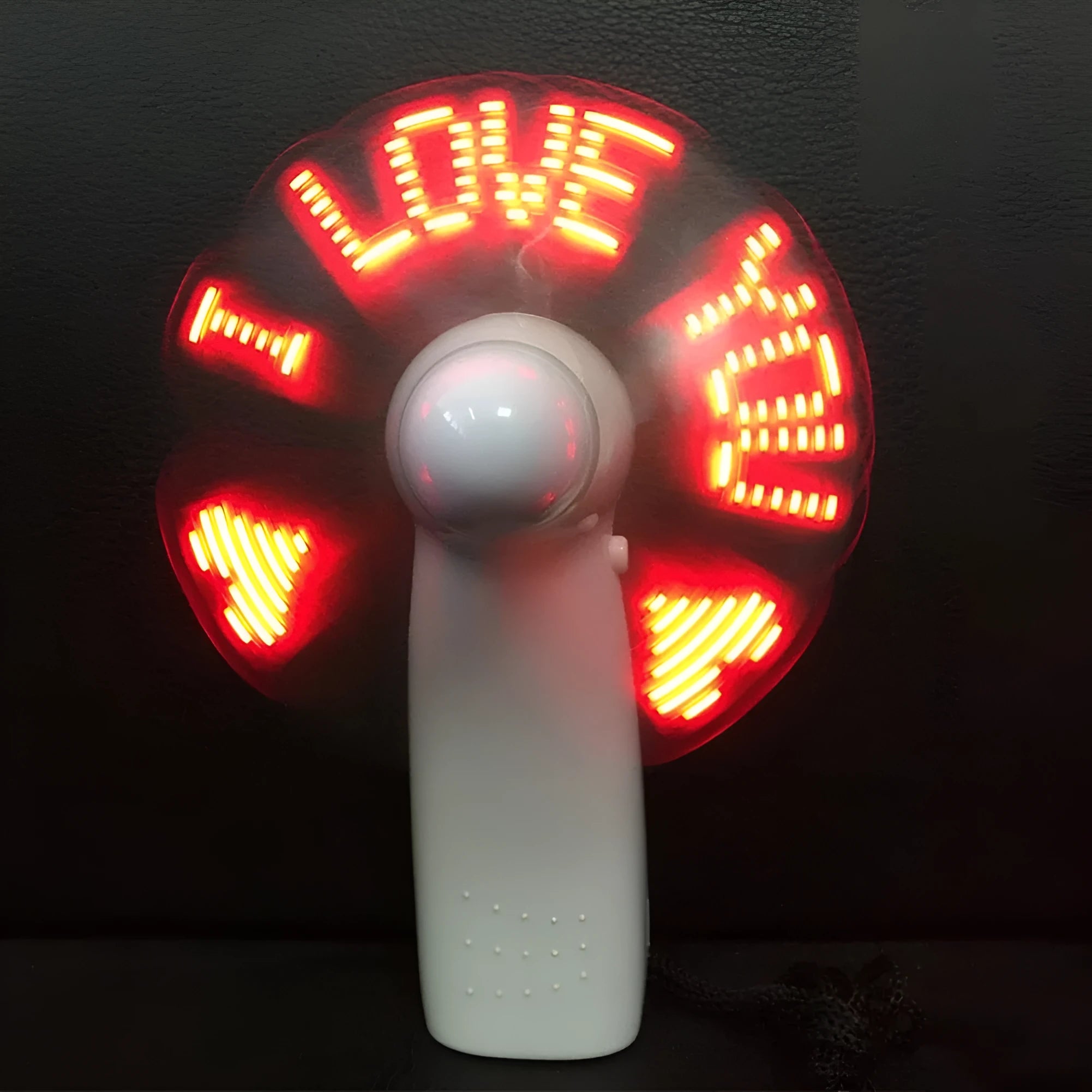 White mini handheld fan with blue and red LED love pattern display, showing dimensions.