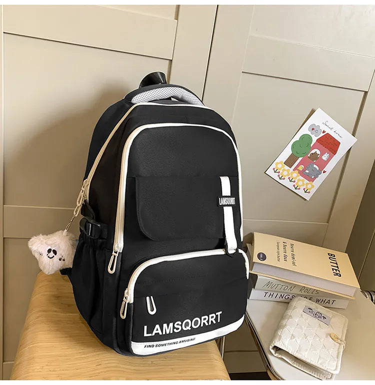 High school student backpack in waterproof nylon with curved shoulder straps and under 20L capacity