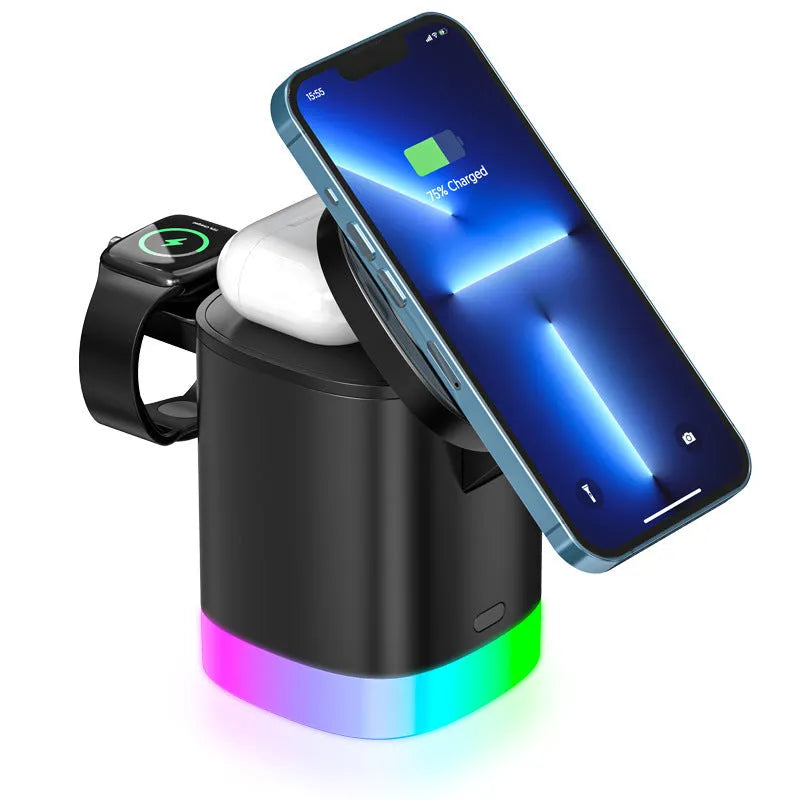 Black foldable 3-in-1 magnetic wireless charging station showing phone, watch and earbuds charging with RGB light on.
