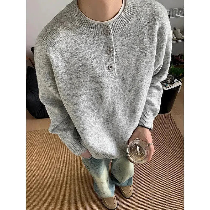 Men's loose long sleeve knit sweater in black, front view, casual pullover style
