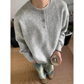 Men's loose long sleeve knit sweater in black, front view, casual pullover style