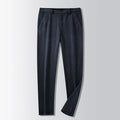 Straight-leg striped trousers in a khaki colour, showing the zip fly front and classic fit.