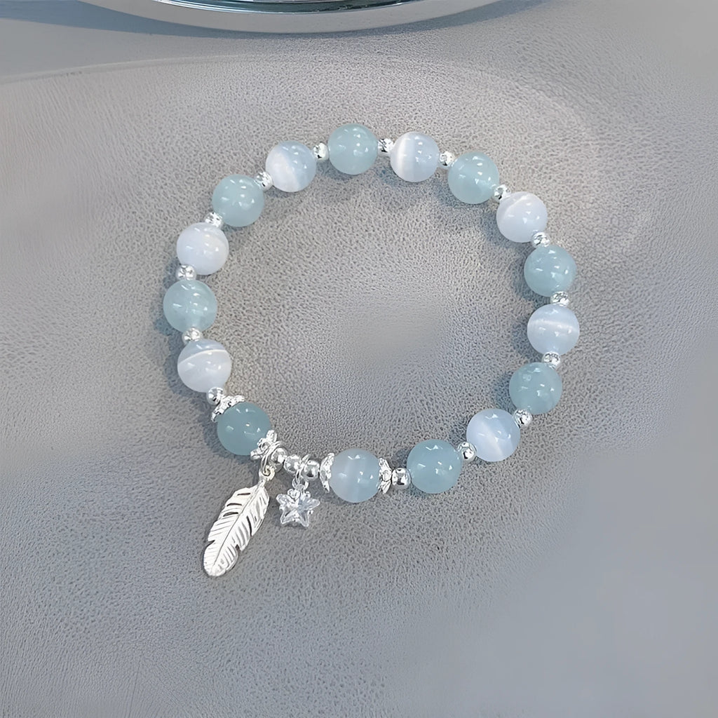 Small white crystal bracelet with eight star design in blue moonlight colour
