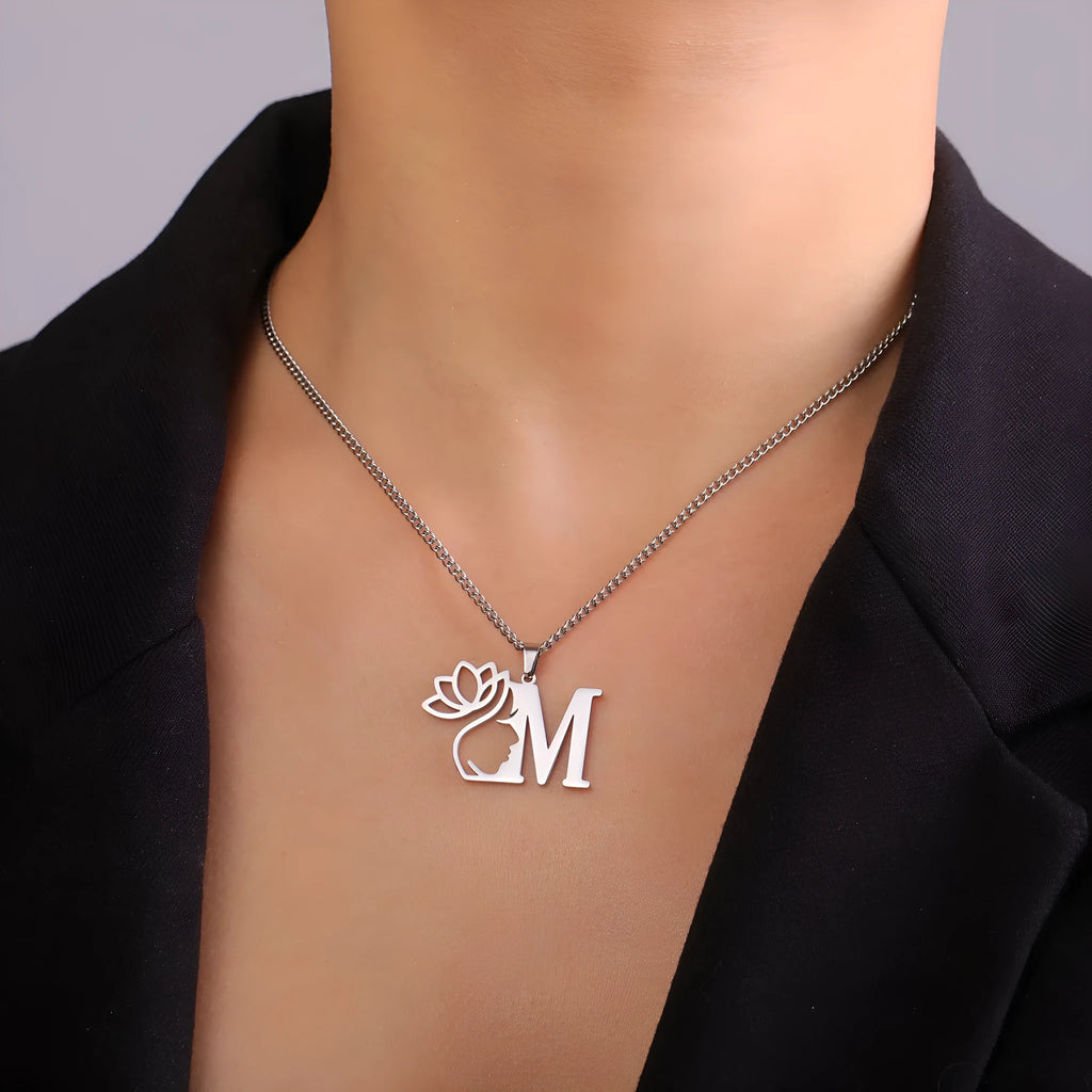 Stainless steel necklace with cross chain and a single initial pendant in a gold or silver finish.