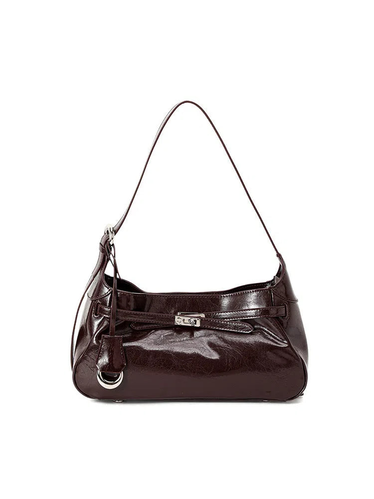 Genuine leather horizontal square crossbody bag with stitching and inner zippered compartment in brown