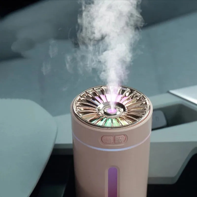 Portable black USB humidifier with colourful lights on car cup holder