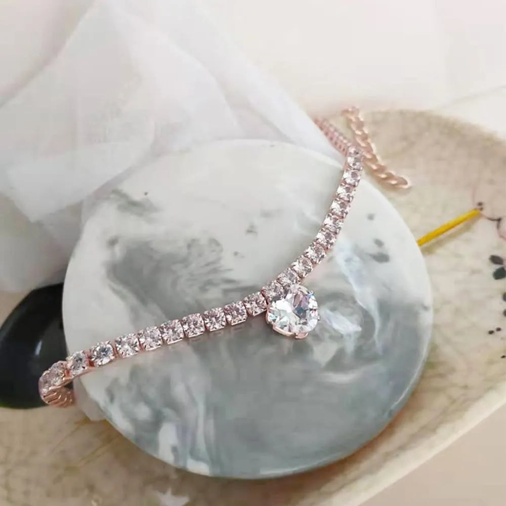 Heart-shaped rhinestone pet collar in metallic gold with extension chain for dogs and cats