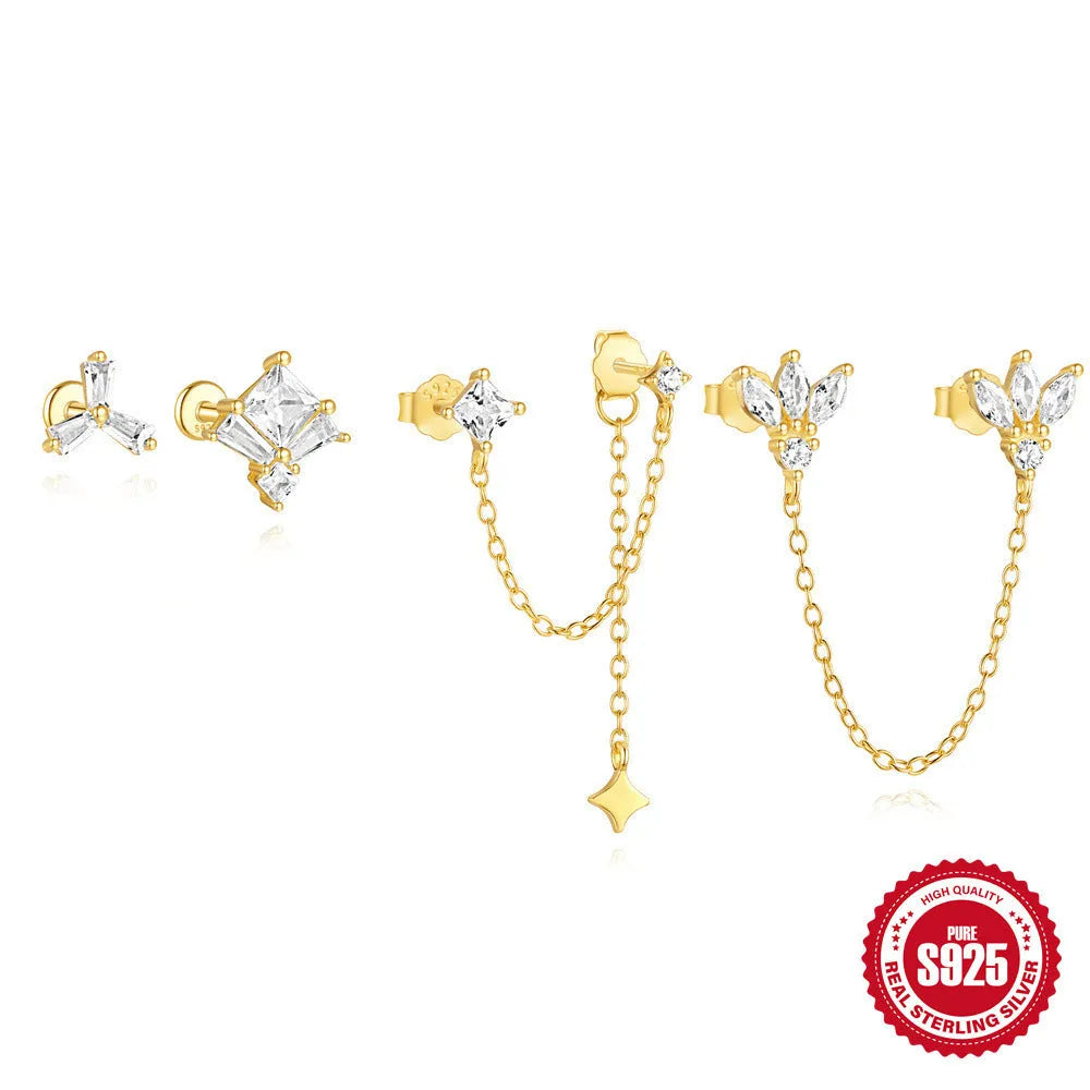 S925 sterling silver stud earring with golden double piercing design and zircon inlaid detail on a white background.