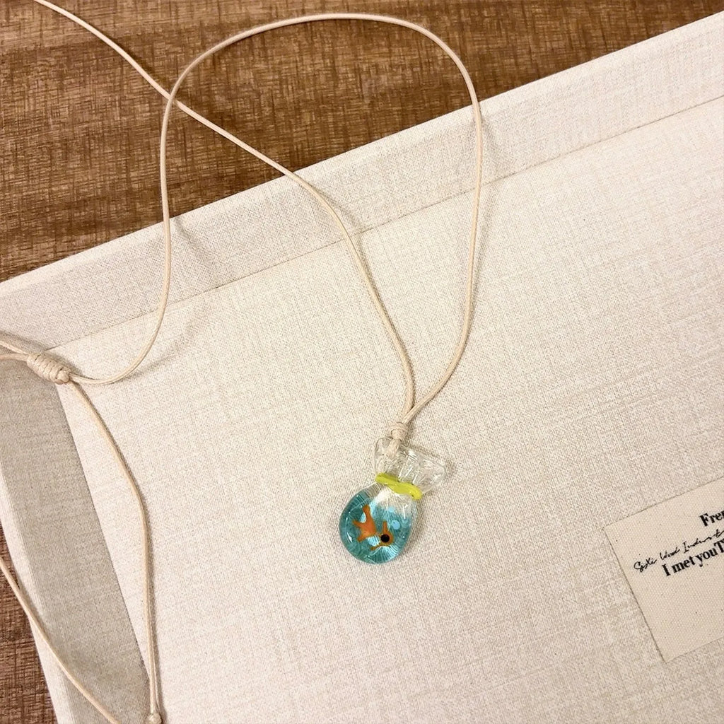 Women's necklace with coloured glaze skirt pendant on cotton linen clavicle chain