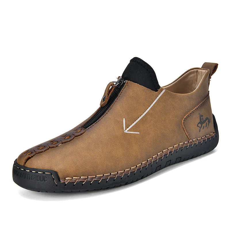 Men's black leather martin boots with a front zip, round toe, and hand-stitched seams on a rubber sole.