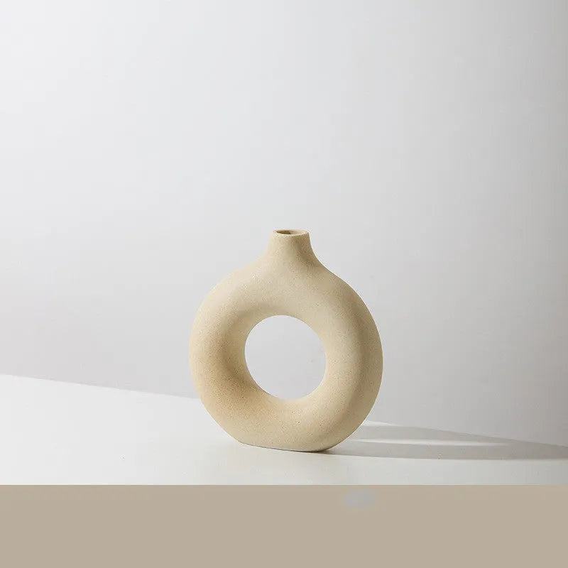 Unglazed porcelain biscuit vase with frosted particle surface in neutral colour