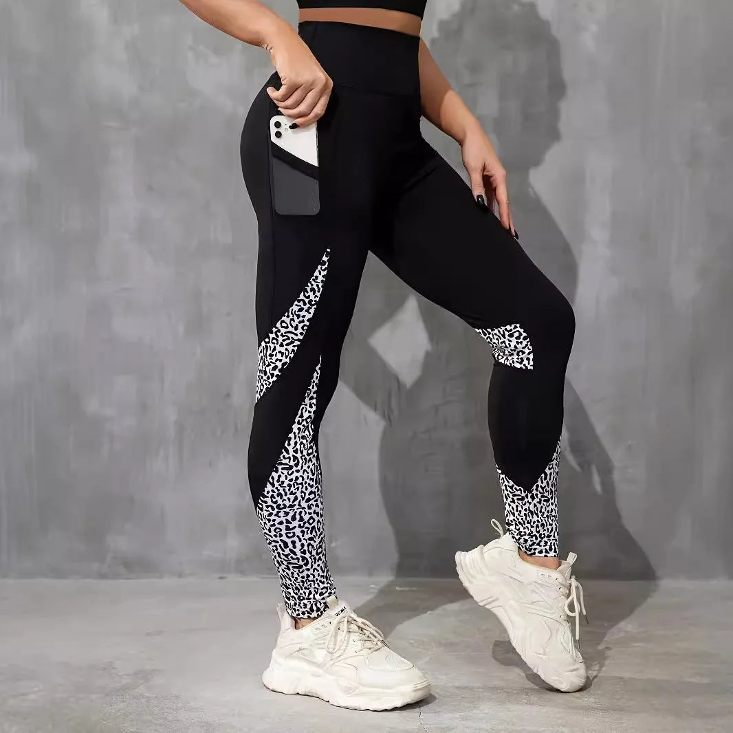 Women's black high waist yoga leggings with contrast patchwork leopard print design and side pocket