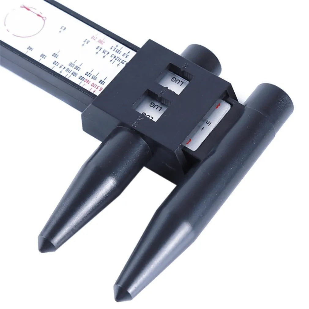 Electronic digital hole distance ruler on a workshop bench.